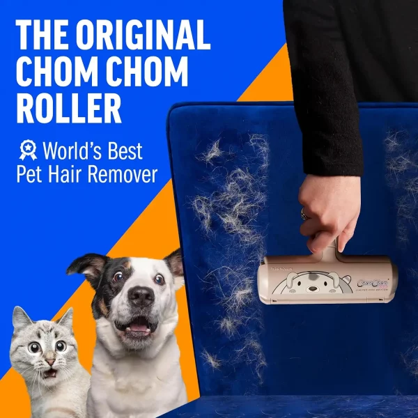 original-chomchom-roller-blue-velvet-chair Close-up action shot of a hand removing white pet hair from a blue velvet chair using the limited dog edition ChomChom roller. A cat and dog look surprised in the foreground